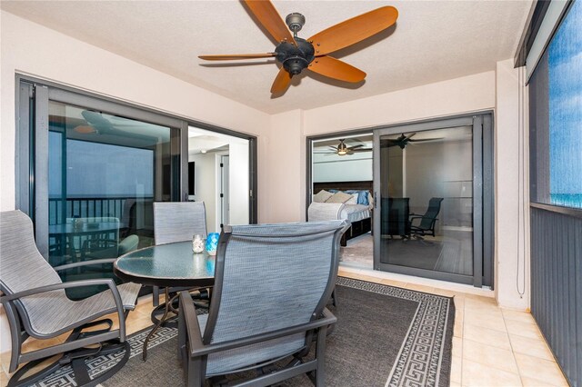 interior space with ceiling fan