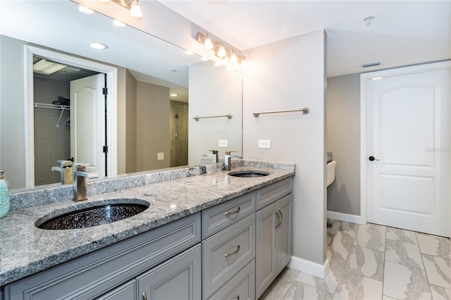 bathroom with tile patterned flooring and double sink vanity