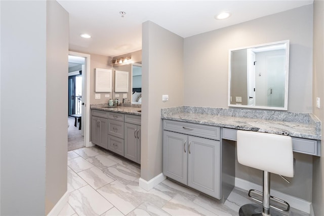 bathroom featuring tile patterned flooring and vanity