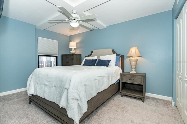 carpeted bedroom with a closet and ceiling fan