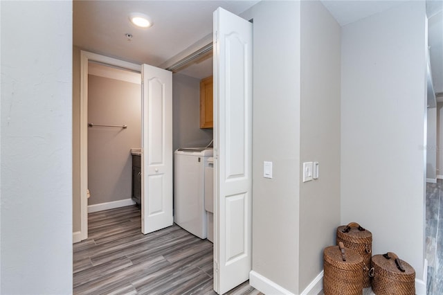 washroom featuring washer / dryer and light hardwood / wood-style flooring