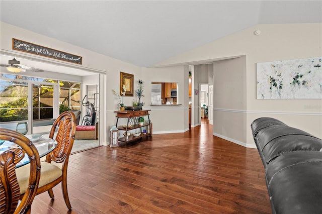 interior space featuring lofted ceiling, ceiling fan, and dark hardwood / wood-style floors