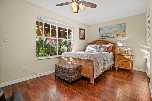 bedroom with ceiling fan and dark hardwood / wood-style floors