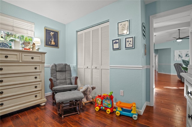 rec room with dark hardwood / wood-style flooring and ceiling fan