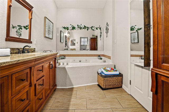 bathroom featuring a bath and vanity