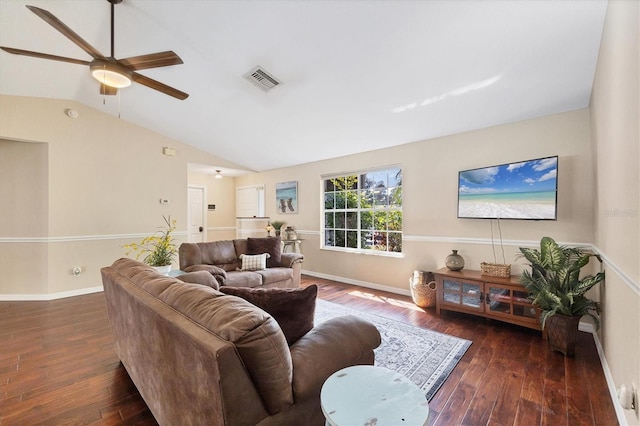 living area featuring lofted ceiling, hardwood / wood-style floors, visible vents, and baseboards