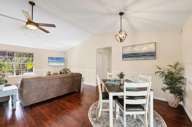 dining area with lofted ceiling, visible vents, and hardwood / wood-style flooring