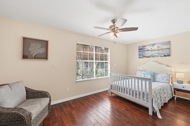 bedroom featuring a ceiling fan, baseboards, and hardwood / wood-style floors