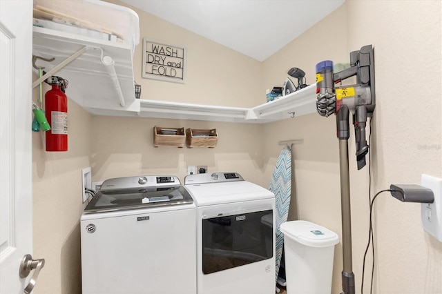 laundry area featuring laundry area and washer and clothes dryer