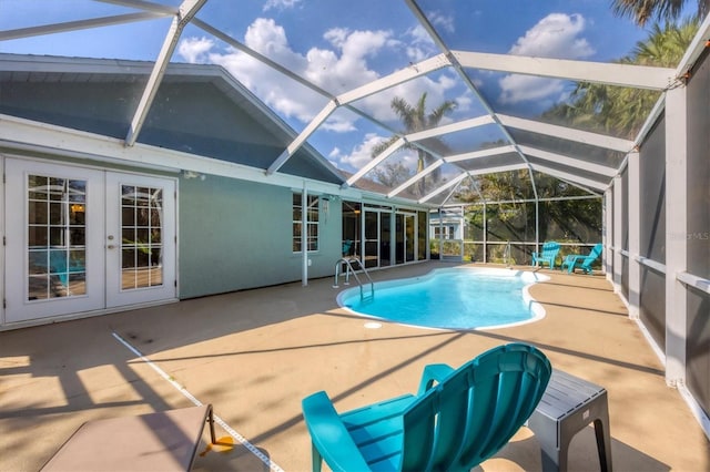 pool with a patio, french doors, and a lanai