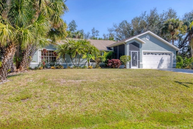 ranch-style home featuring an attached garage, stucco siding, driveway, and a front yard