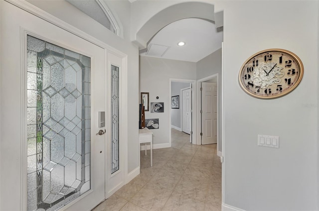 entryway with light tile patterned floors