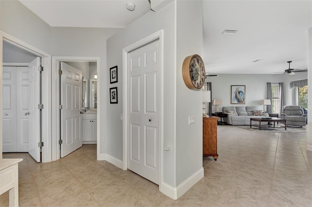 hallway featuring light tile patterned floors