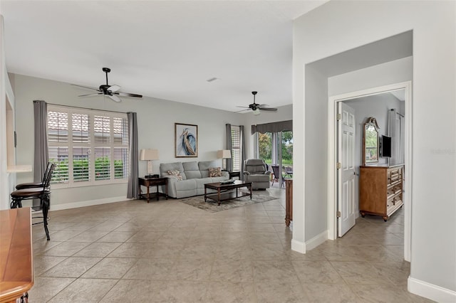 tiled living room with ceiling fan