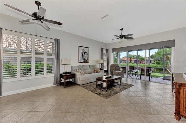 tiled living room featuring ceiling fan