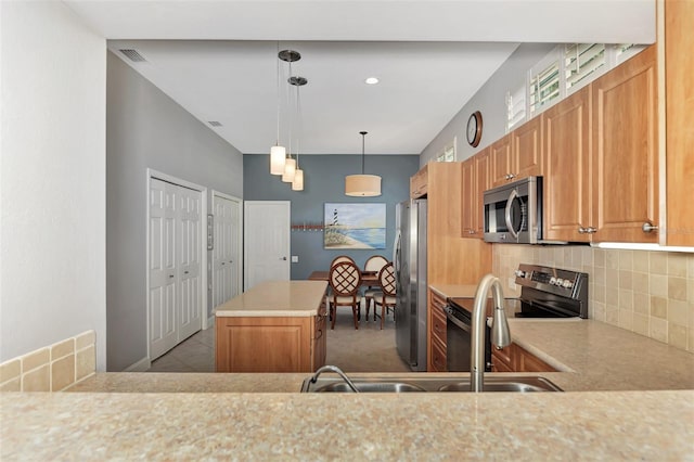 kitchen with hanging light fixtures, backsplash, stainless steel appliances, a kitchen island, and kitchen peninsula