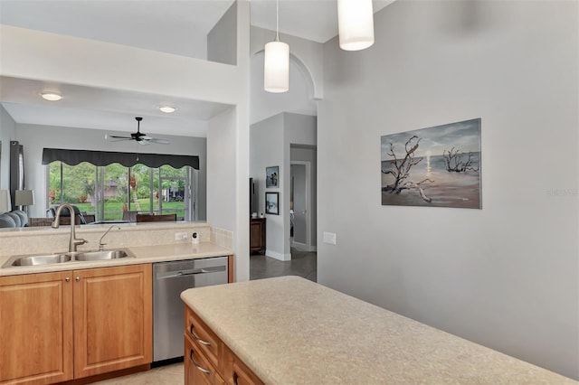 kitchen with hanging light fixtures, dishwasher, sink, and ceiling fan