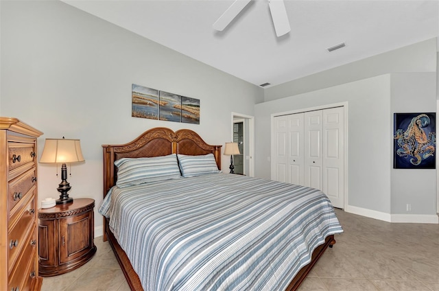 bedroom featuring a closet, ceiling fan, and light tile patterned flooring