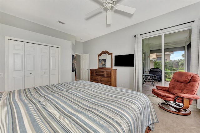 tiled bedroom featuring ceiling fan, access to exterior, and a closet