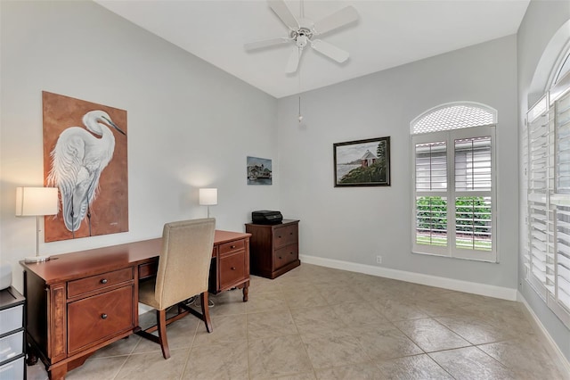 office area with light tile patterned floors and ceiling fan