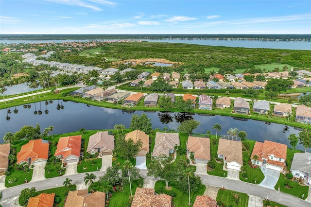 bird's eye view with a water view