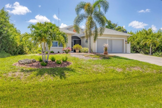 view of front of house featuring a garage and a front yard