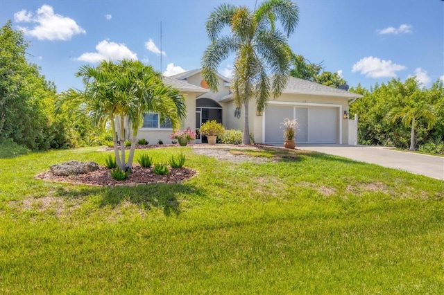 view of front facade with a garage and a front lawn