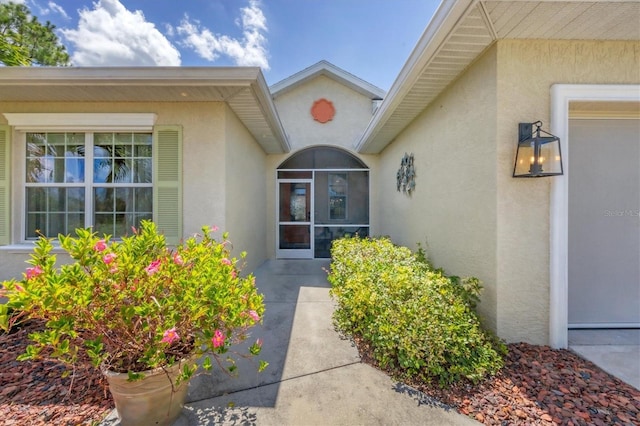 property entrance with a patio area