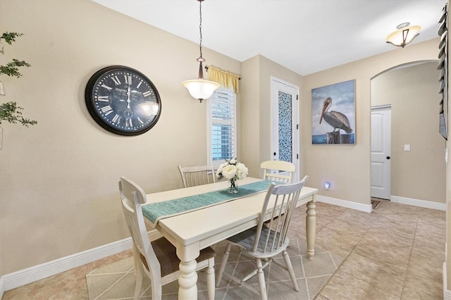 dining space with light tile patterned floors