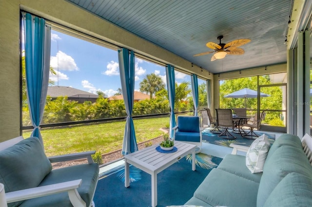 sunroom / solarium with ceiling fan