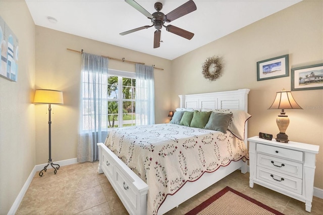 tiled bedroom featuring ceiling fan