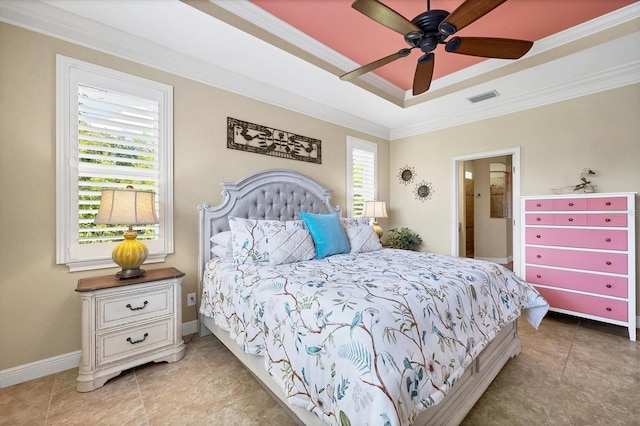 bedroom featuring light tile patterned flooring, ceiling fan, crown molding, and a tray ceiling