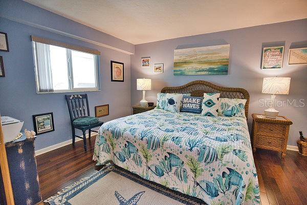 bedroom featuring dark wood-type flooring