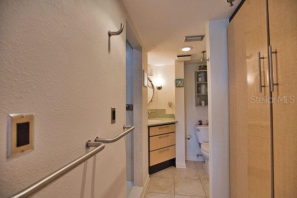 hall featuring light tile patterned flooring