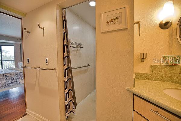 bathroom with vanity and hardwood / wood-style flooring