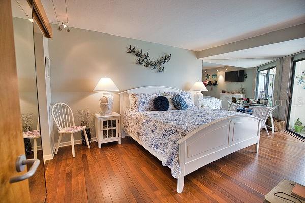 bedroom featuring dark wood-type flooring