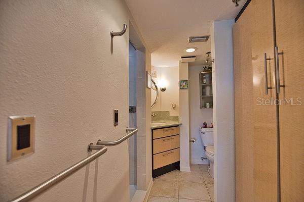 hallway featuring light tile patterned floors