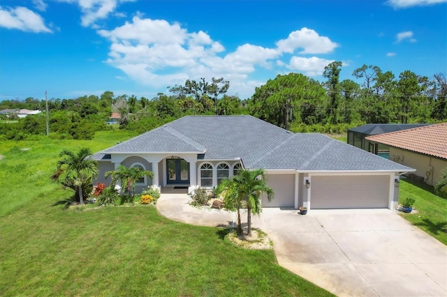 view of front of property featuring a garage and a front lawn