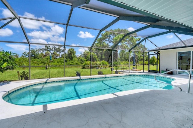 view of swimming pool with glass enclosure, a patio area, and a lawn