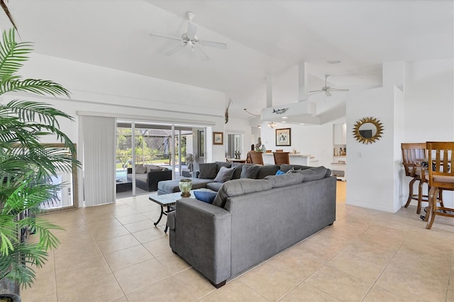 tiled living room featuring high vaulted ceiling and ceiling fan