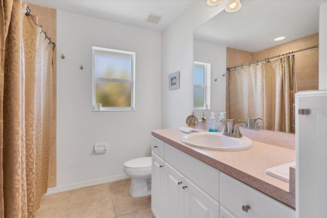 bathroom with tile patterned floors, toilet, and vanity