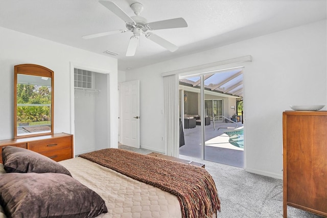 carpeted bedroom with ceiling fan, access to exterior, a closet, and multiple windows