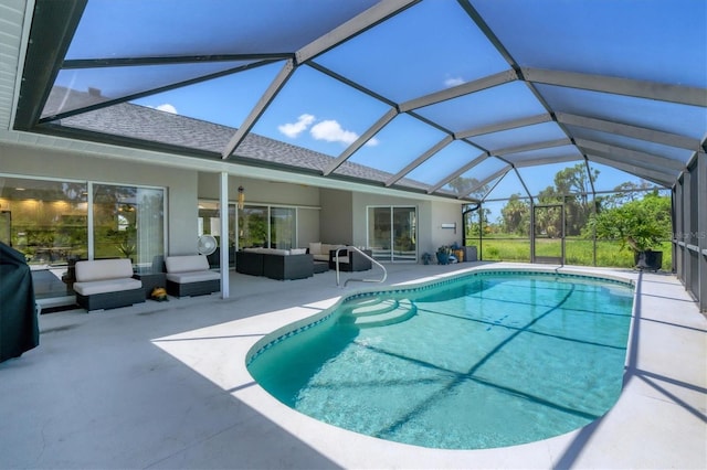 view of swimming pool with a lanai, an outdoor living space, and a patio