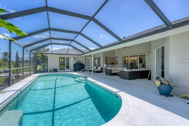 view of pool with an outdoor hangout area, ceiling fan, a lanai, and a patio