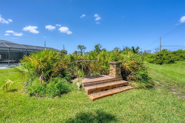 view of yard with a lanai