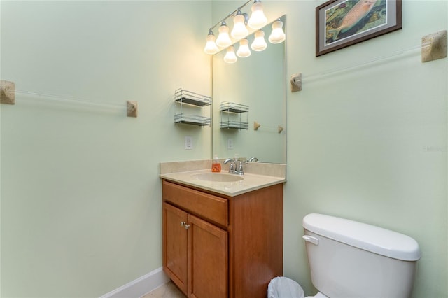 bathroom with toilet and vanity