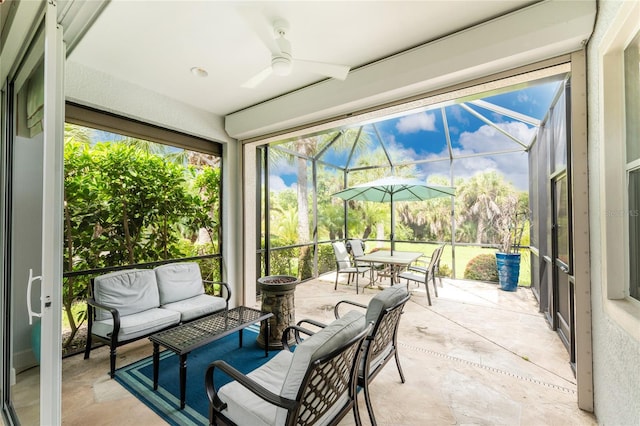 sunroom / solarium with ceiling fan and plenty of natural light