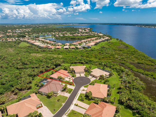 birds eye view of property featuring a water view