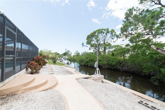 view of home's community with a water view