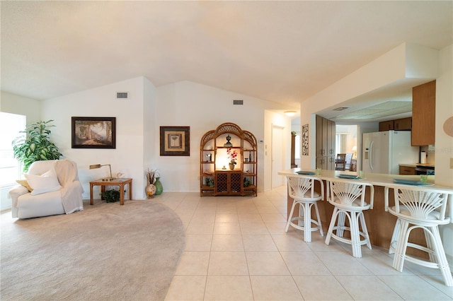 3440 Downing St W, Englewood, FL 34224 - dining area with lofted ceiling and light tile patterned flooring